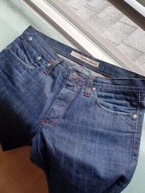 DKNY, 32'' WAIST AND 34'' INSEAM, BLUE WITH THE RED BOTTOM DETAILS.